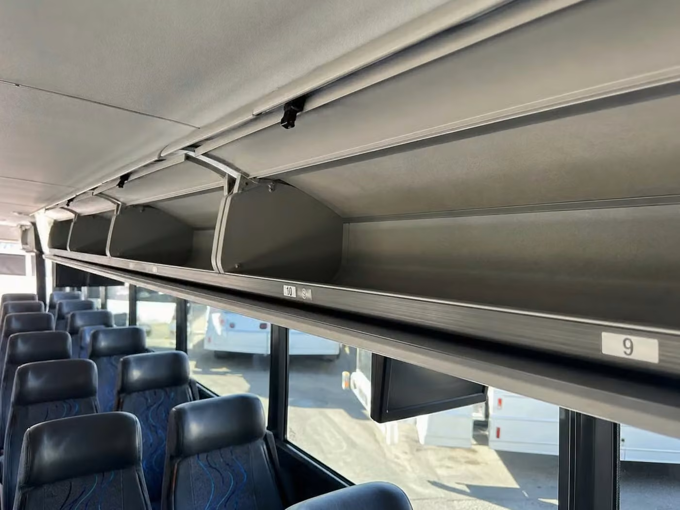 south bend 56 passenger charter bus overhead storage